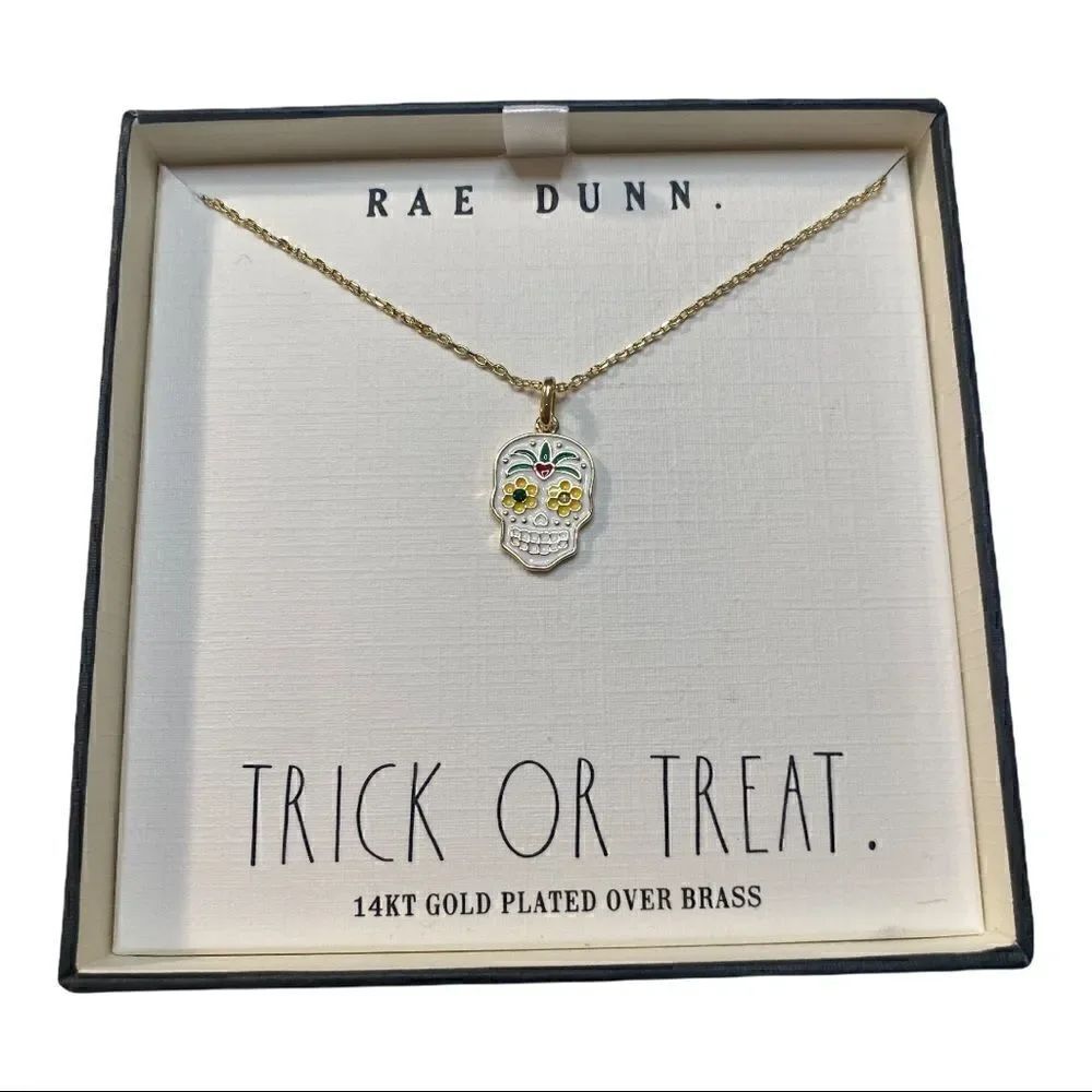 Rae Dunn Sugar Skull Necklace on delicate gold toned chain.